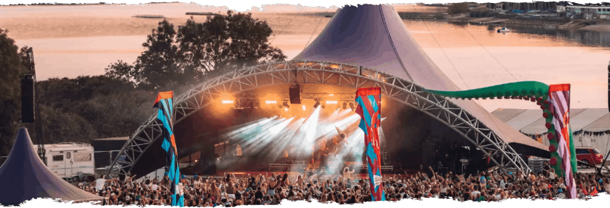 Outside stage with lighting showing the crowd